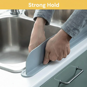Flexible silicone faucet splash guard for kitchen and bathroom sinks, helping reduce water splashes and keeping countertops neat, dry, and organized.
