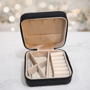 Portable jewellery organizer with soft interior compartments for storing rings, necklaces, earrings, bracelets, and small accessories in a secure and organized way.